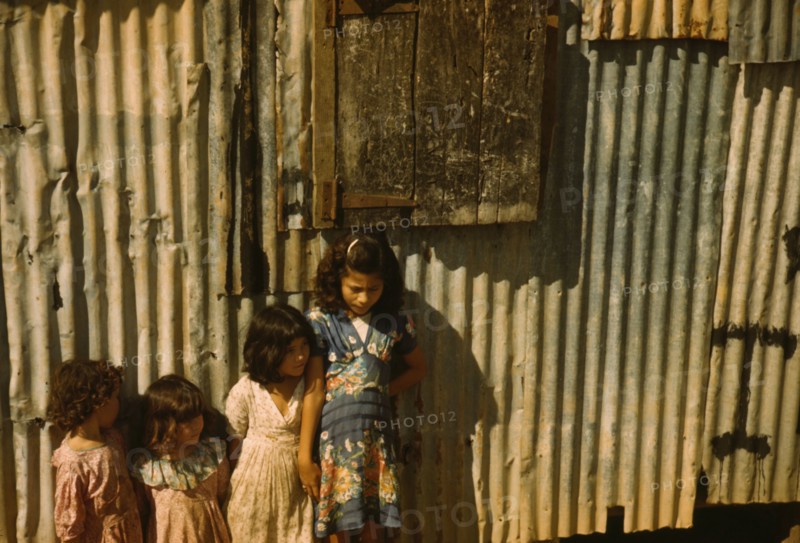 Children in a company housing settlement, Puerto Rico, 1941. Creator: Jack Delano.