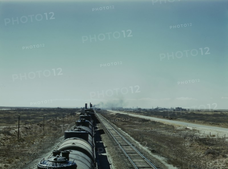 West bound Santa Fe R.R. freight train stopping for water, Tolar, New Mexico, 1943. Creator: Jack Delano.