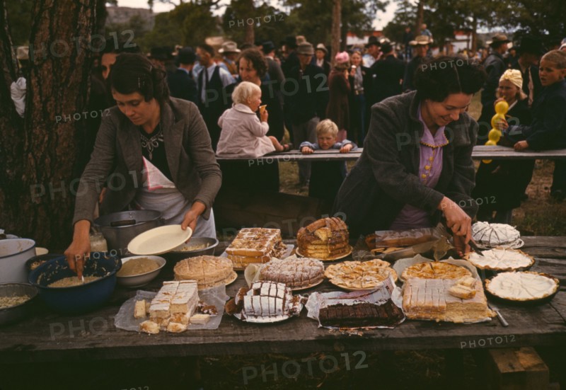 Cutting the pies and cakes at the barbeque dinner, Pie Town, New Mexico Fair, 1940. Creator: Russell Lee.