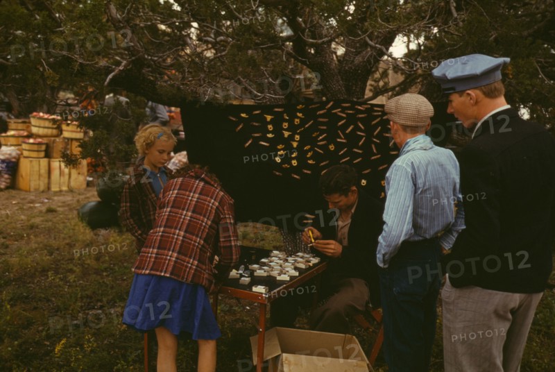 Initial pin souvenirs at the Pie Town, New Mexico Fair, 1940. Creator: Russell Lee.