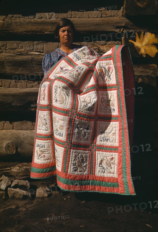 Mrs. Bill Stagg with state quilt which she made, Pie Town, New Mexico, 1940. Creator: Russell Lee.
