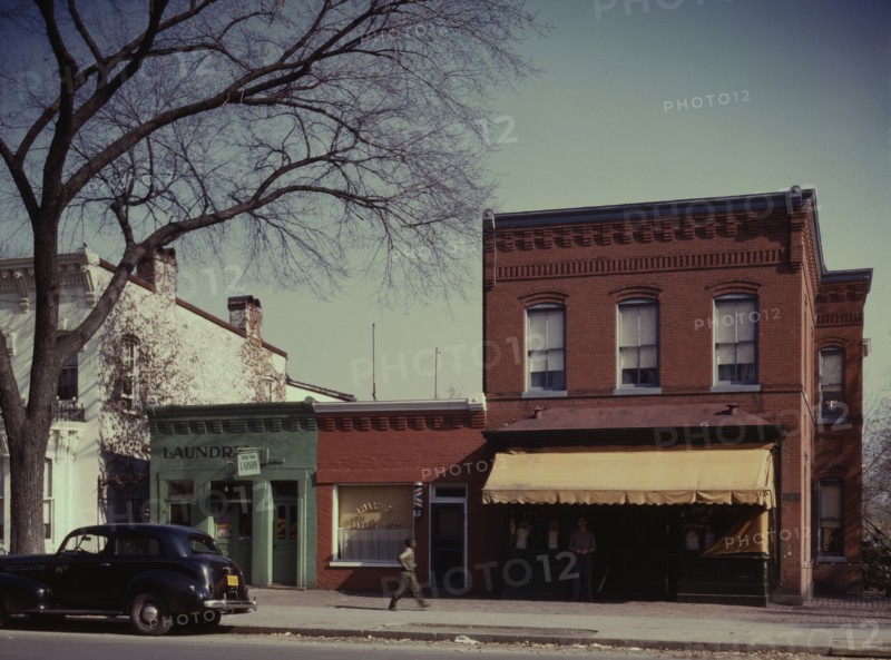 Laundry, barbershop and store, Washington, D.C.?, between 1941 and 1942. Creator: Louise Rosskam.