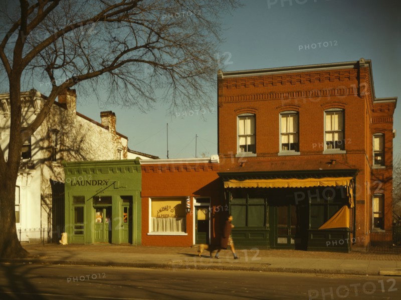Laundry, barbershop and stores, Washington, D.C.?, between 1941 and 1942. Creator: Louise Rosskam.