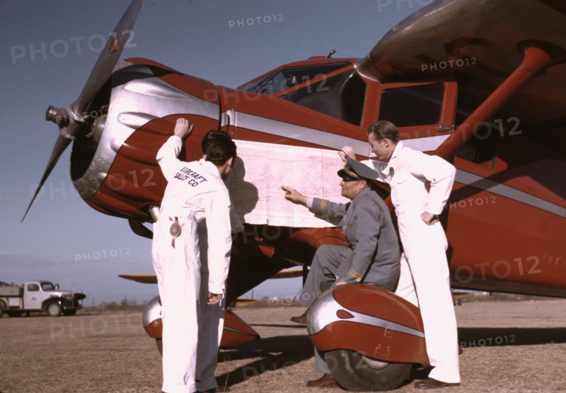 Instructor and students studying a map, Meacham Field, Fort Worth, Tex., 1942. Creator: Arthur Rothstein.