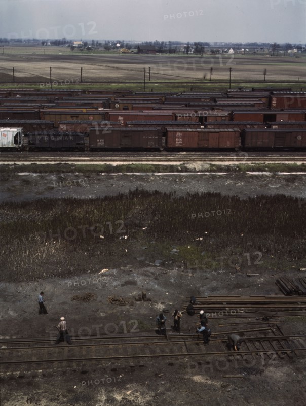 Section crew at work on the track, C. M. St. P. & P. R.R., Bensenville, Ill., 1943. Creator: Jack Delano.