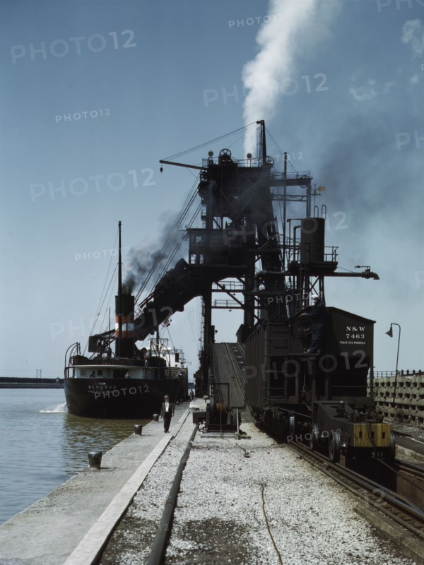 Loading a lake freighter with coal at the Pennsylvania R.R. coal docks...Sandusky, Ohio, 1943. Creator: Jack Delano.