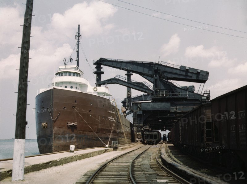 Pennsylvania R.R. ore docks, unloading iron ore from a lake freighter..., Cleveland, Ohio, 1943. Creator: Jack Delano.