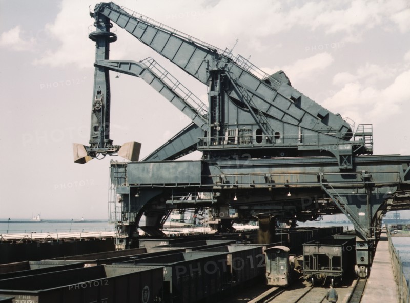 Unloading a lake freighter at the Pennsylvania Railroad iron ore docks...Cleveland, Ohio, 1943. Creator: Jack Delano.