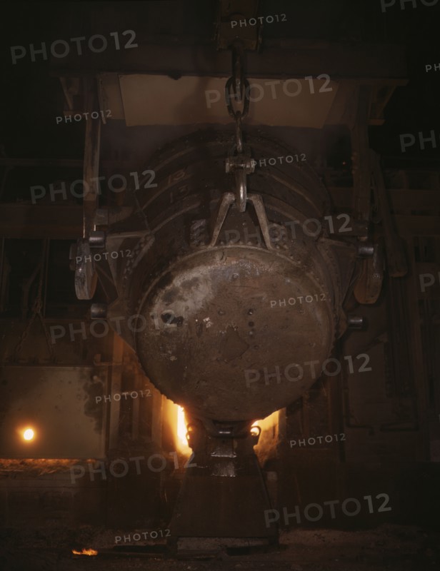 Ladle of molten iron is poured into..., Allegheny Ludlum Steele Corp., Brackenridge, Pa., (1941?). Creator: Alfred T Palmer.