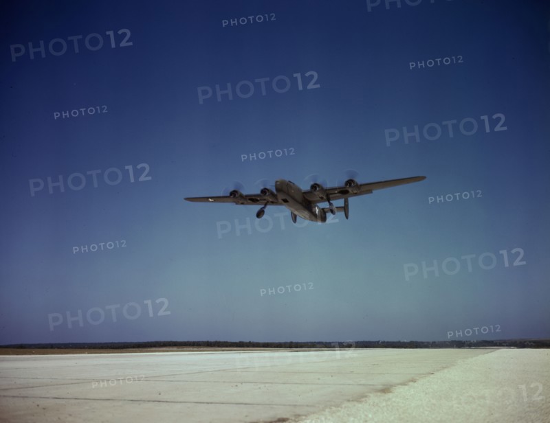 Transport plane takes off on test flight, Consolidated Aircraft Corp., Fort Worth, Texas, 1942. Creator: Howard Hollem.