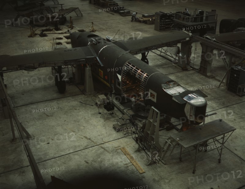 A mating operation on a transport plane...Consolidated Aircraft Corp..., Fort Worth, Texas, 1942. Creator: Howard Hollem.
