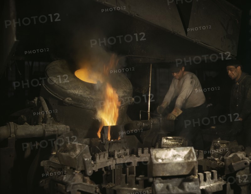 Casting a billet from an electric furnace, Chase Brass and Copper Co., Euclid, Ohio, 1942. Creator: Alfred T Palmer.