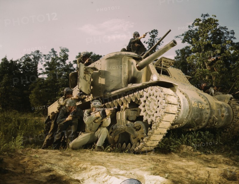 M-3 tank and crew using small arms, Ft. Knox, Ky., 1942. Creator: Alfred T Palmer.