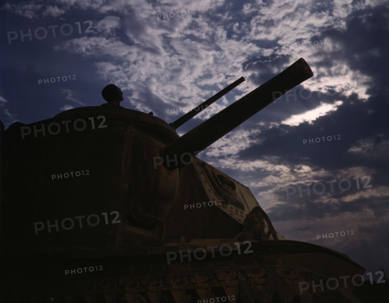 The crew of an M-3 tank learn all the ways of causing trouble for the Axis...Fort Knox, Ky, 1942. Creator: Alfred T Palmer.