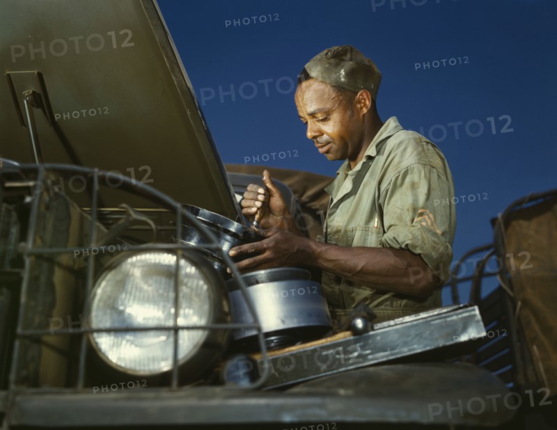 A good job in the air cleaner of an army truck, Fort Knox, Ky., 1942. Creator: Alfred T Palmer.