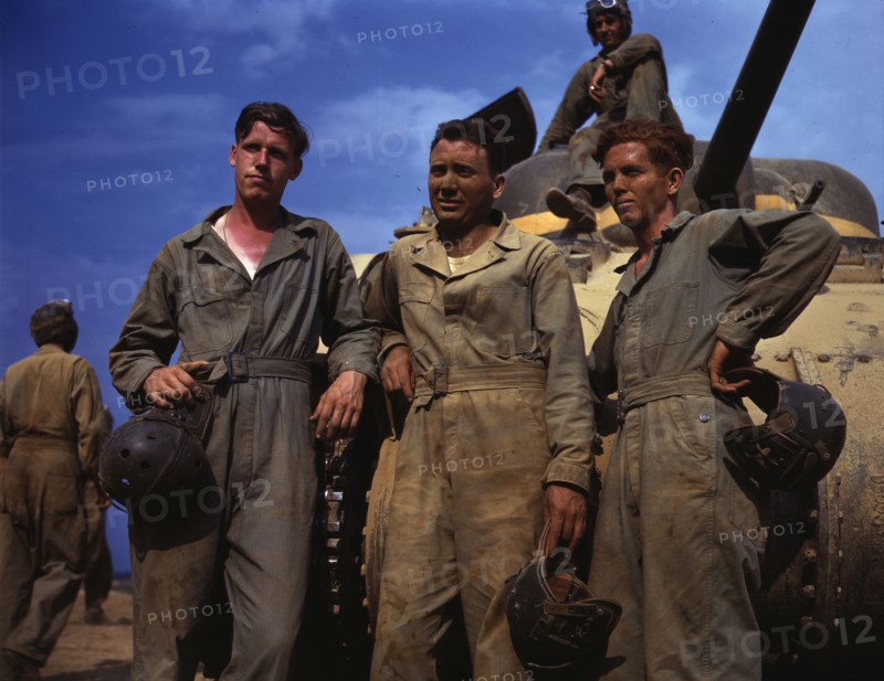 Tank crew standing in front of M-4 tank, Ft. Knox, Ky., 1942. Creator: Alfred T Palmer.