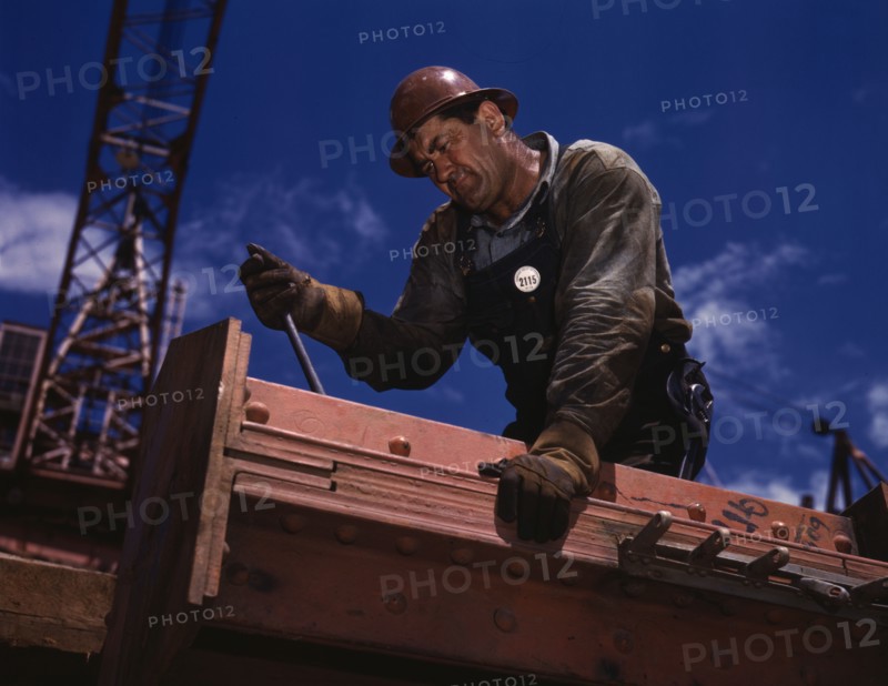 Big Pete Ramagos, rigger at work on dam (TVA) Douglas Dam, Tenn., 1942. Creator: Alfred T Palmer.