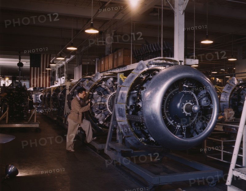 Cowling and control rods are added to motors for...North American Inc., Inglewood, Calif., 1942. Creator: Alfred T Palmer.