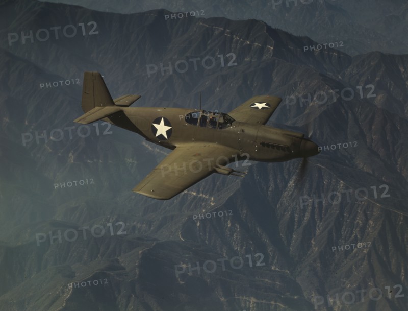P-51 "Mustang" fighter in flight, Inglewood, Calif. , 1942. Creator: Alfred T Palmer.