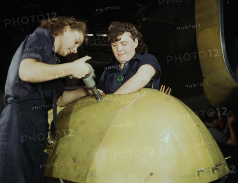 Working on a "Vengeance" dive bomber, Vultee [Aircraft Inc.], Nashville, Tennessee, 1943. Creator: Alfred T Palmer.