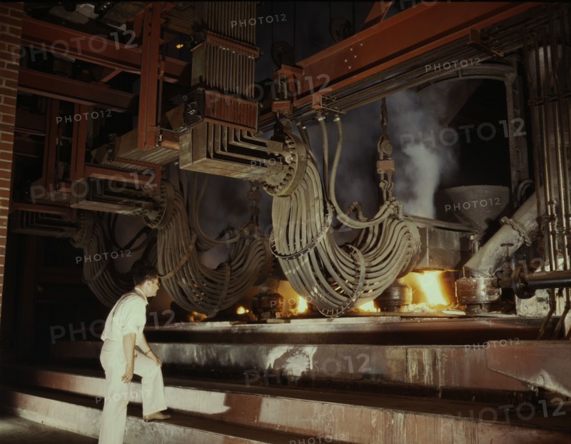 A large electric phosphate smelting furnace used in the making...Muscle Shoals area, Alabama, 1942. Creator: Alfred T Palmer.