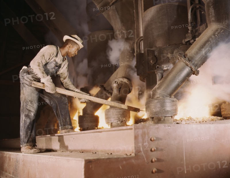 A large electric phosphate smelting furnace used to make...vicinity of Muscle Shoals, Ala., 1942. Creator: Alfred T Palmer.