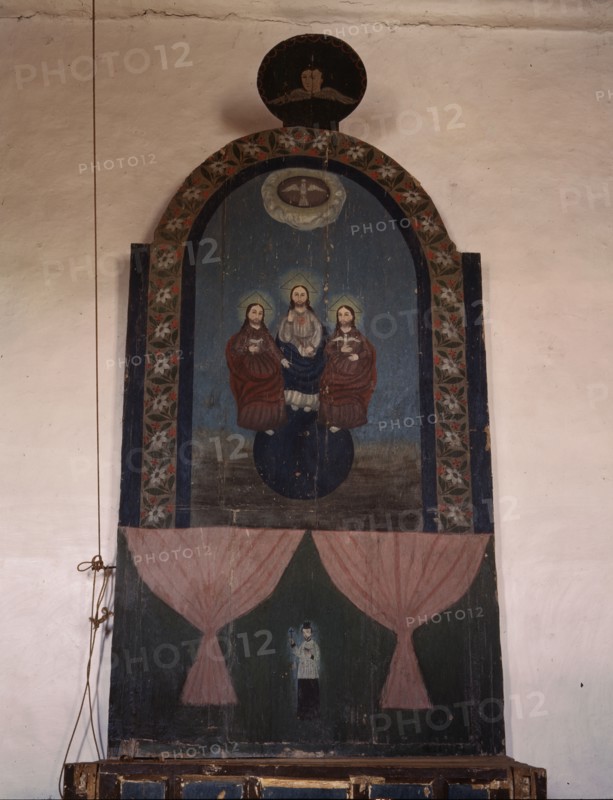An altar in the church dedicated to the Trinity, Trampas, N.M., 1943. Creator: John Collier.