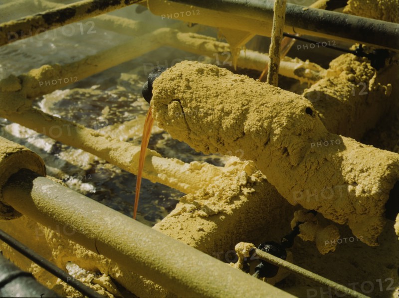 Melted sulphur from the wells pouring into relay..., Freeport Sulphur Co, Hoskins Mound, Texas, 1943 Creator: John Vachon.