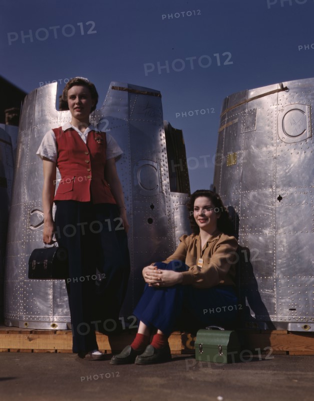 Two assembly line workers at the Long Beach, Calif., plant of Douglas Aircraft Company..., 1942. Creator: Alfred T Palmer.