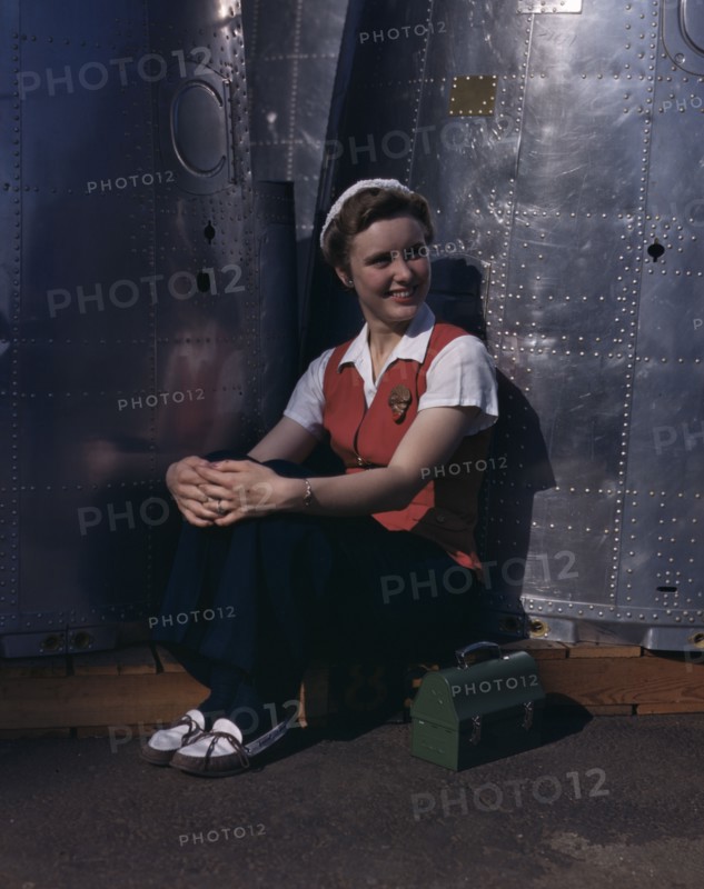 A noontime rest for a full-fledged...Long Beach, Calif., plant of Douglas Aircraft Company, 1942. Creator: Alfred T Palmer.