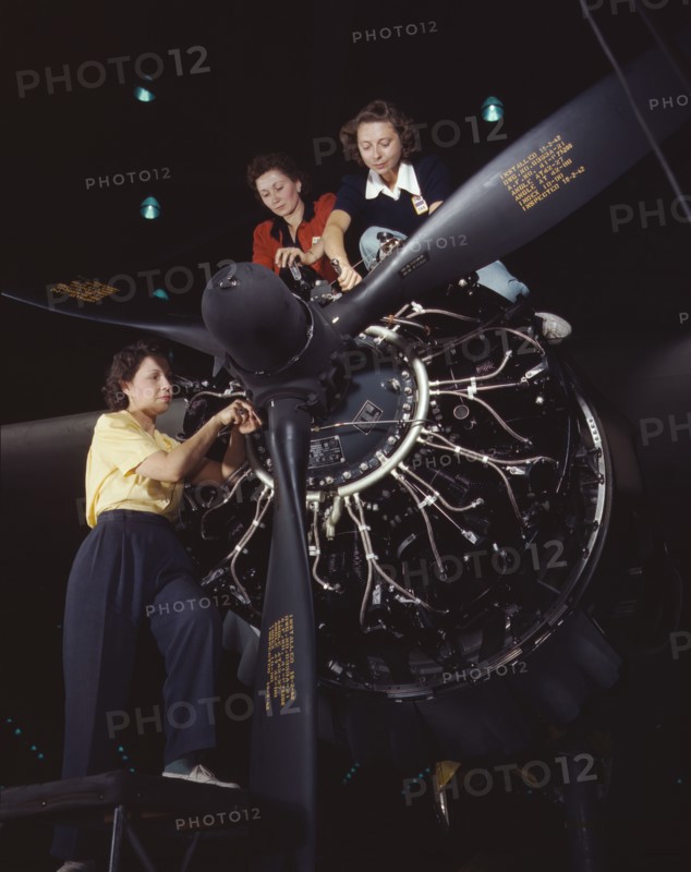 Women at work on C-47 Douglas cargo transport, Douglas Aircraft Company, Long Beach, Calif., 1942. Creator: Alfred T Palmer.