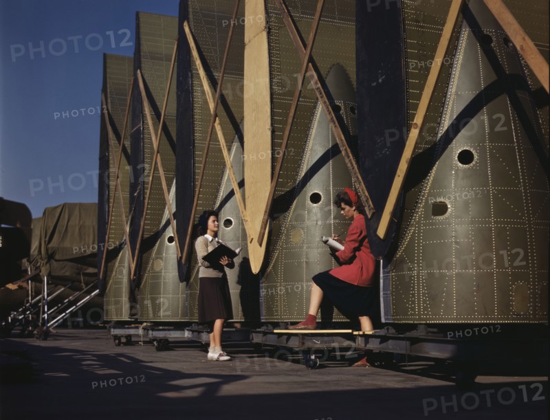 Carefully trained women inspectors check and..., Douglas Aircraft Company, Long Beach, Calif., 1942. Creator: Alfred T Palmer.