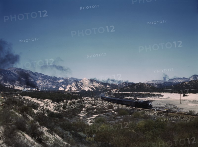 Santa Fe R.R. trains going through Cajon Pass in the San Bernardino Mountains, Cajon, Calif., 1943. Creator: Jack Delano.