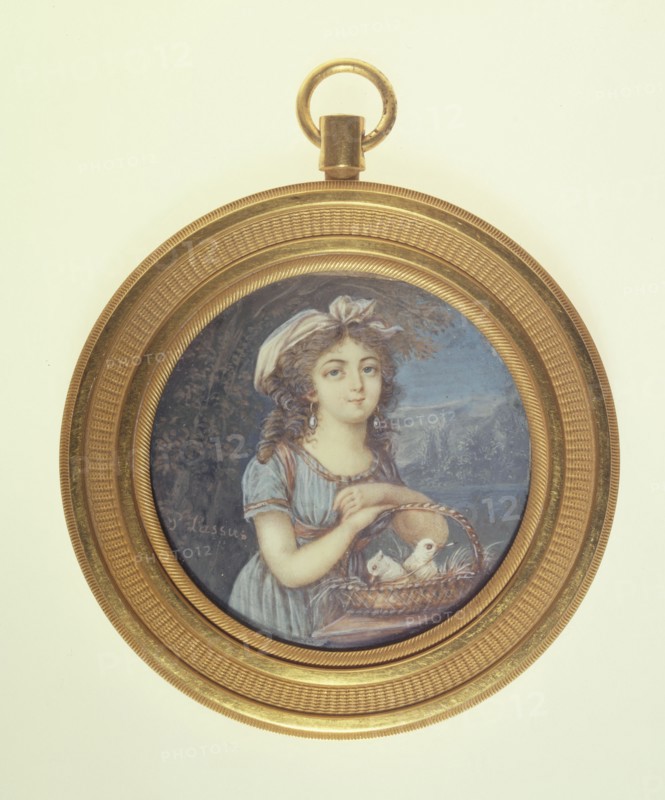 Young girl with two doves.