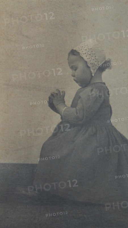 Child with apple, c1900. Creator: Ema Spencer.