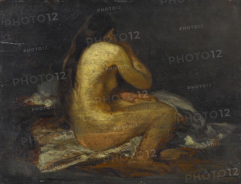 Femme nue assise.