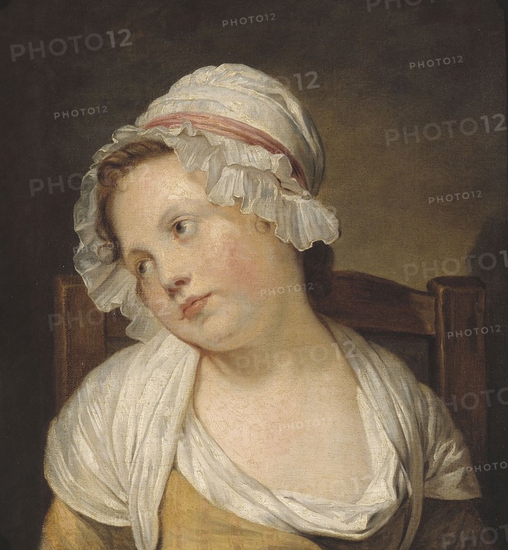 Portrait of a little girl in a white cap.