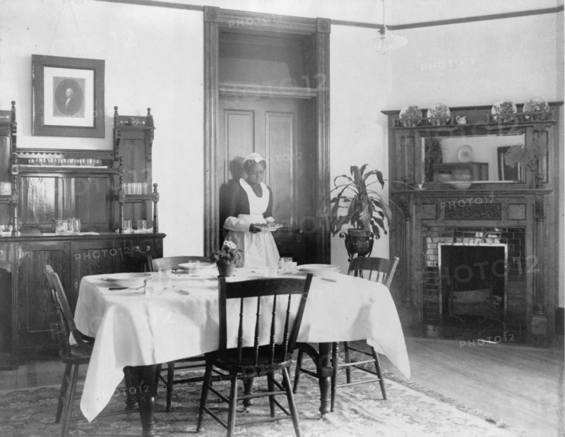 Serving the dinner, 1899 or 1900. Creator: Frances Benjamin Johnston.