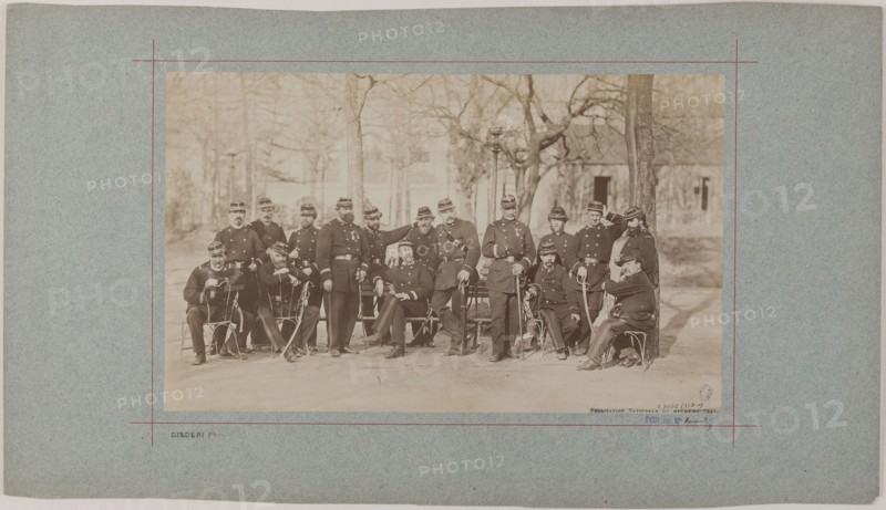 Group portrait of soldiers in a park, 1870.