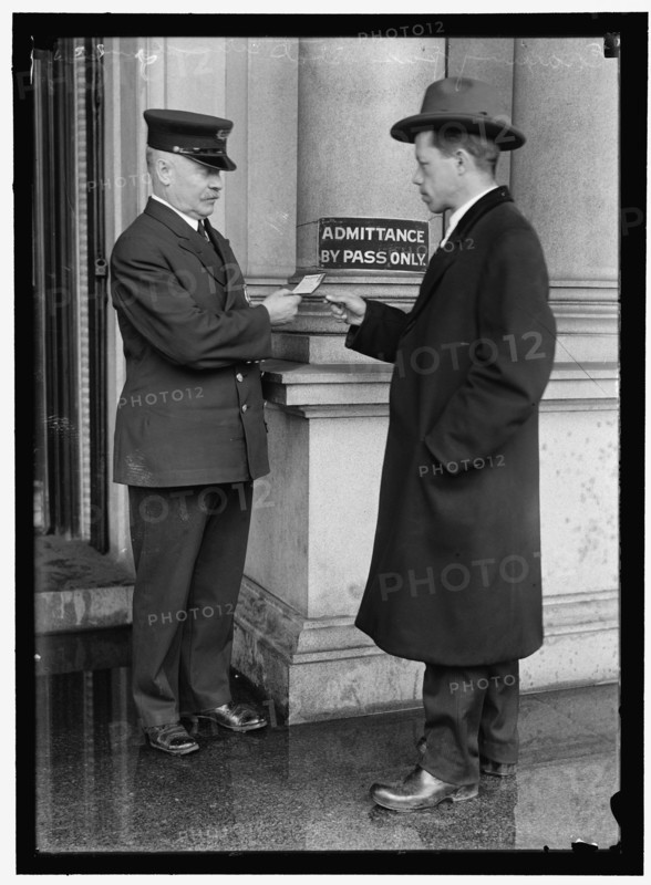 Examining pass at State Department Building, between 1913 and 1918. Creator: Harris & Ewing.