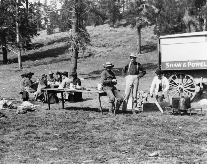 Tourists and guides picnicking in Yellowstone Park, 1903.