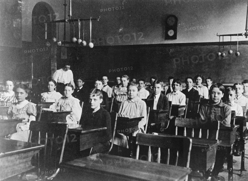 Boys and girls seated at desks in Washington, D.C. classroom, (1899?).