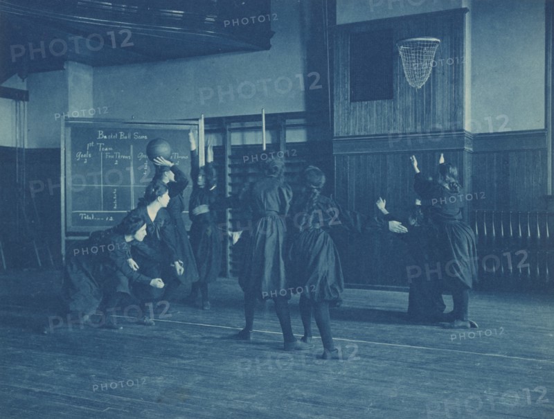 Female students playing basketball, Western High School, Washington, D.C., (1899?).