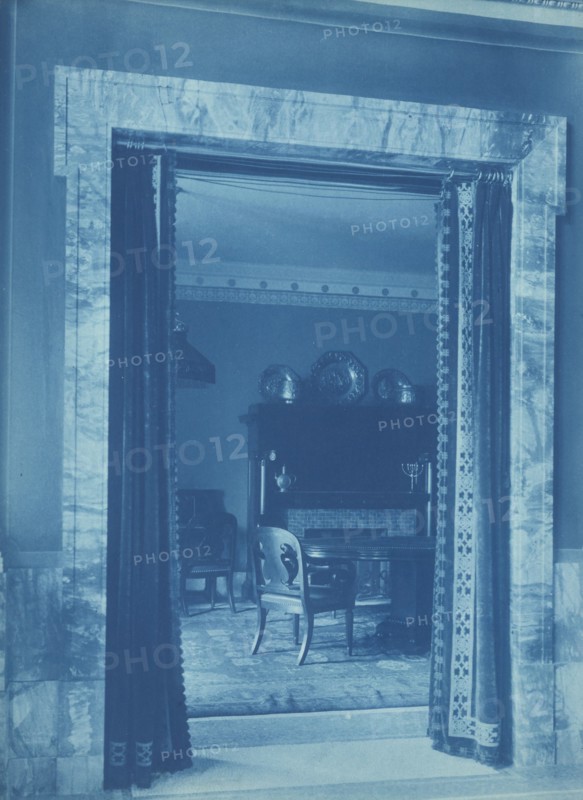 Willard Hotel - view through a curtained doorway to a lounge, between 1901and 1910.