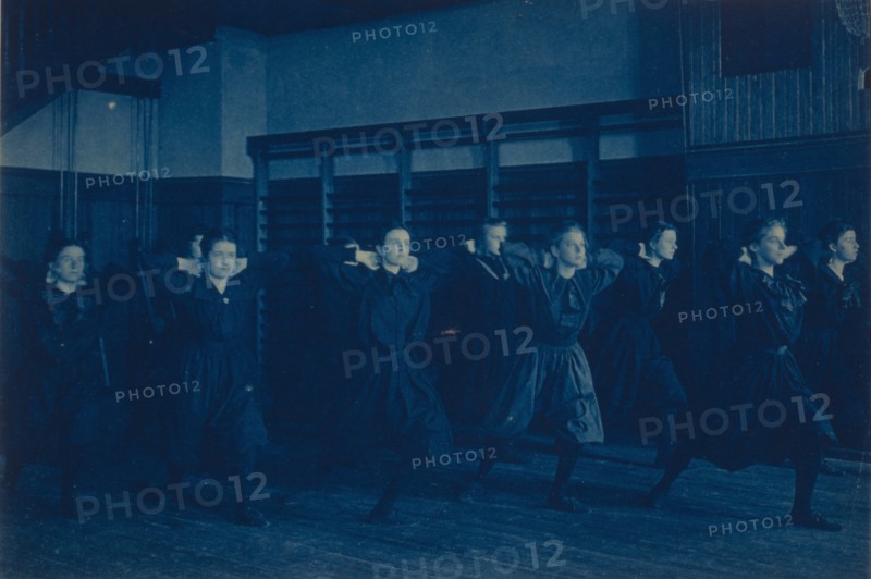 Female students exercising in a gymnasium, Western High School, Washington, D.C., (1899?).