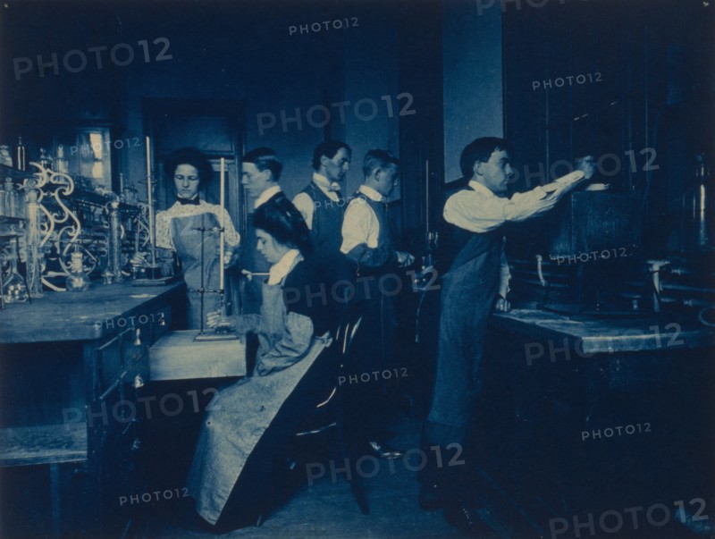 Students conducting experiments in laboratory, Western High School, Washington, D.C., (1899?).