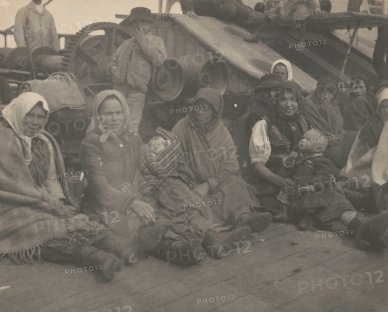 Group of emigrants (women and children) from eastern Europe on deck of the S.S. Amsterdam, 1899.