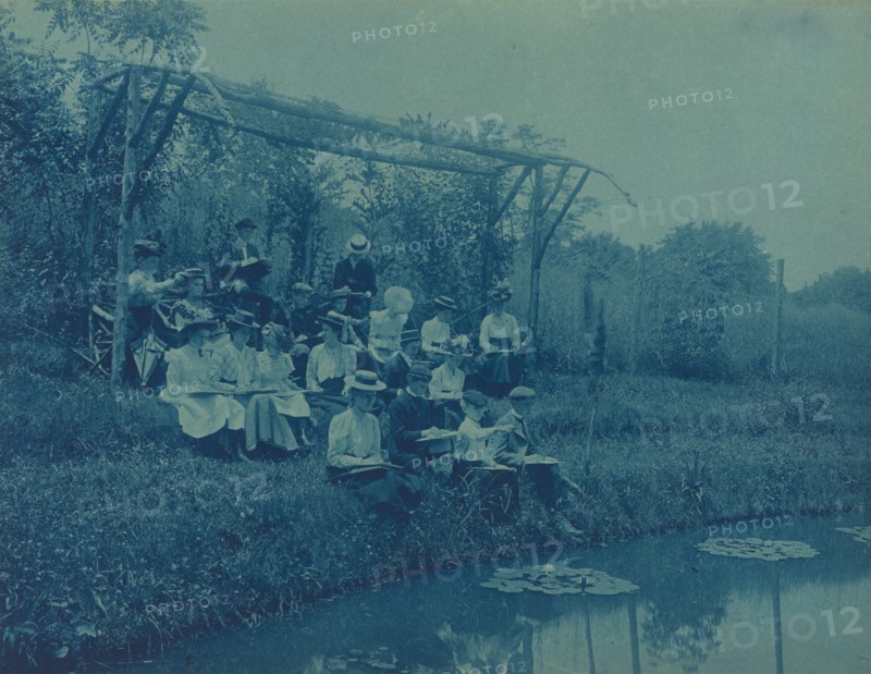 Washington, D.C. public schools field trips - 5th Division children making sketches at edge of pond, (1899?).