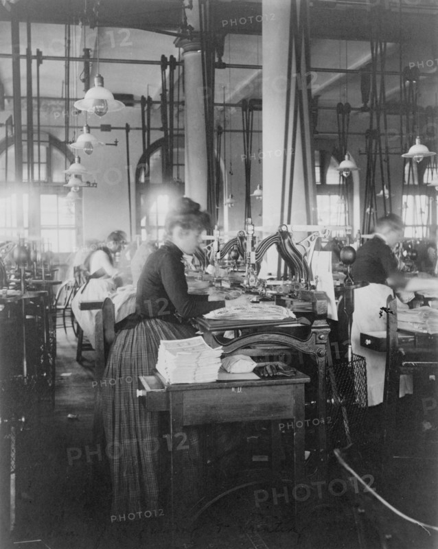 Women operating machinery at the Bureau of Printing and Engraving, Washington, D.C., 1889 or 1890.