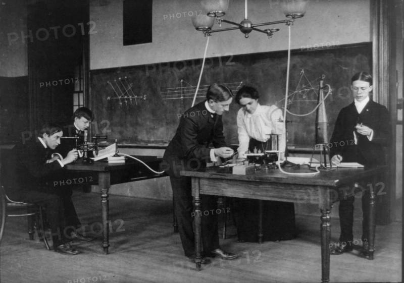 Students in a science class conducting experiments, Western High School, Washington, D.C., (1899?).